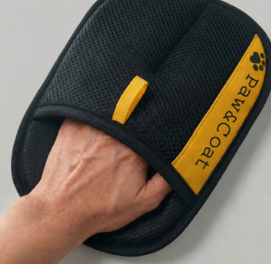 Slipping the Paw & Coat glove onto a hand